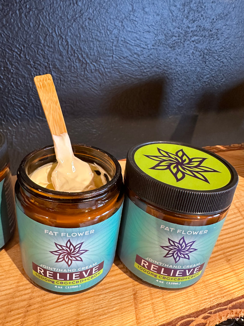 Fat Flower Relieve Joint/Hand Cream with 1000mg CBG+CBD+CBDV in 4oz glass jar with top off showing consistency.